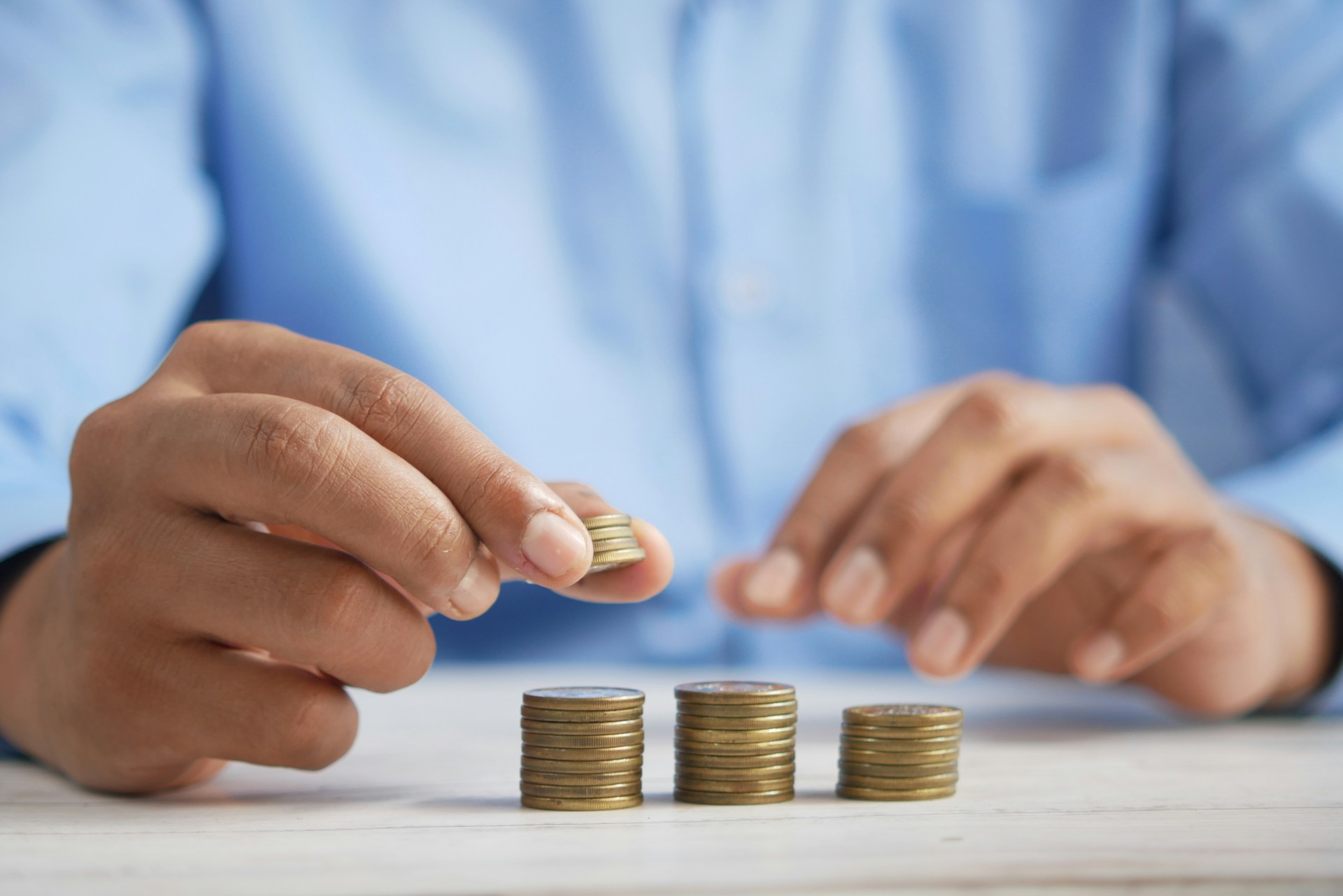 person holding coins