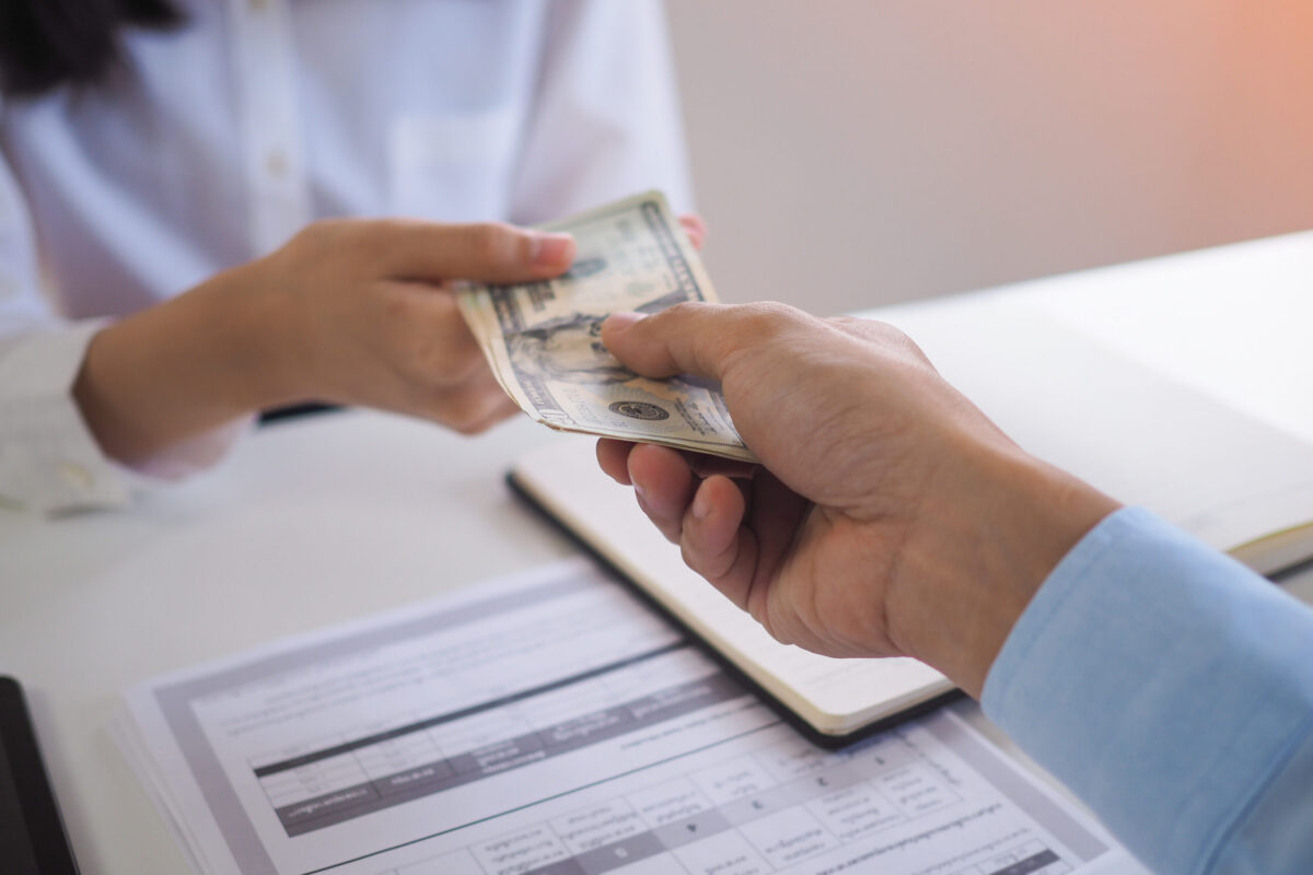 handing cash payment